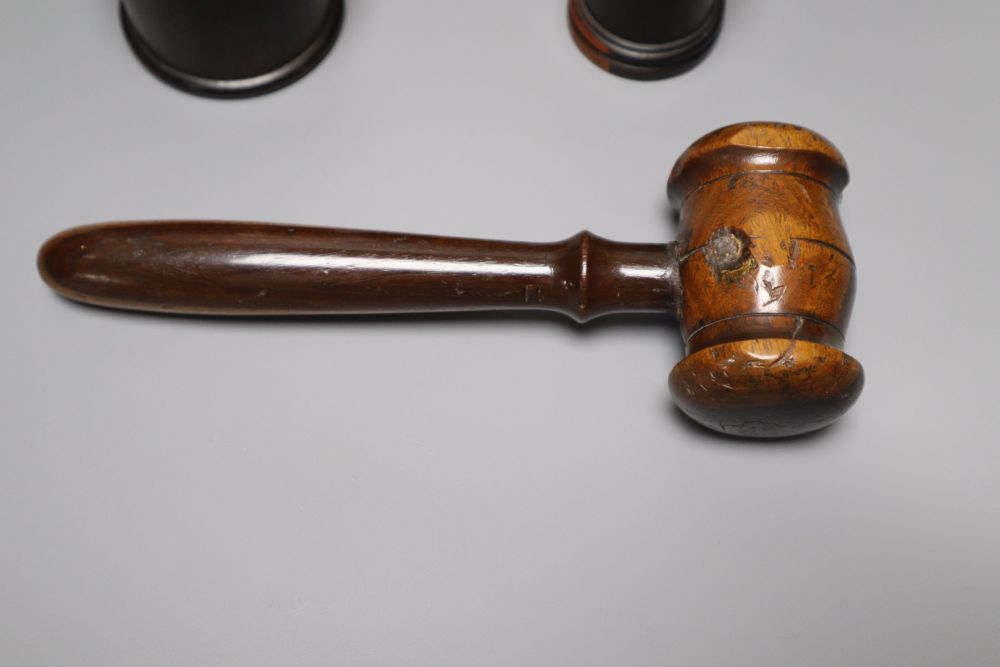 A group of 19th century lignum vitae objects: A pair of whistles and holsters, a match holder with go-to-bed, a model barrel, 9cm, a ga